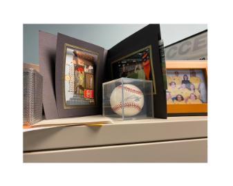 Signed baseball in Kia's office