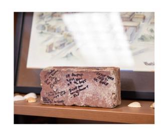 A brick in John's office space