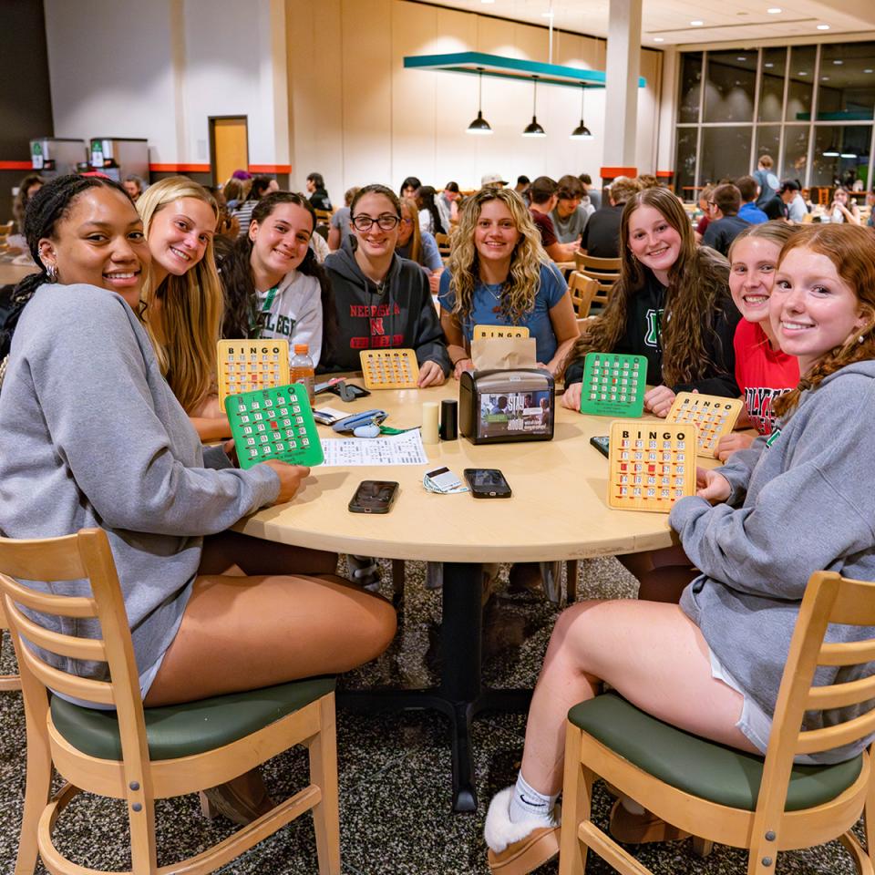 A group of students poses for the camera at Bingo night