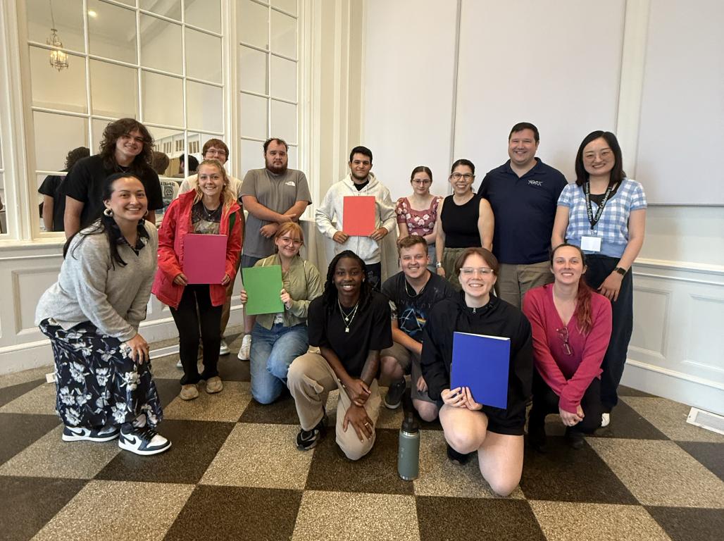 A group of students post for a photo at the YorkTown Hotel