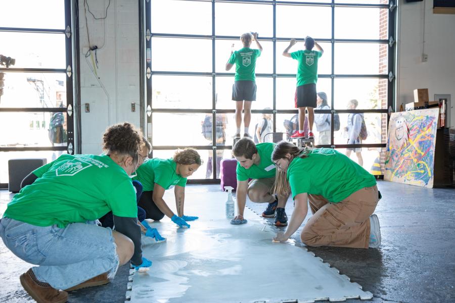 A group of student volunteers working together
