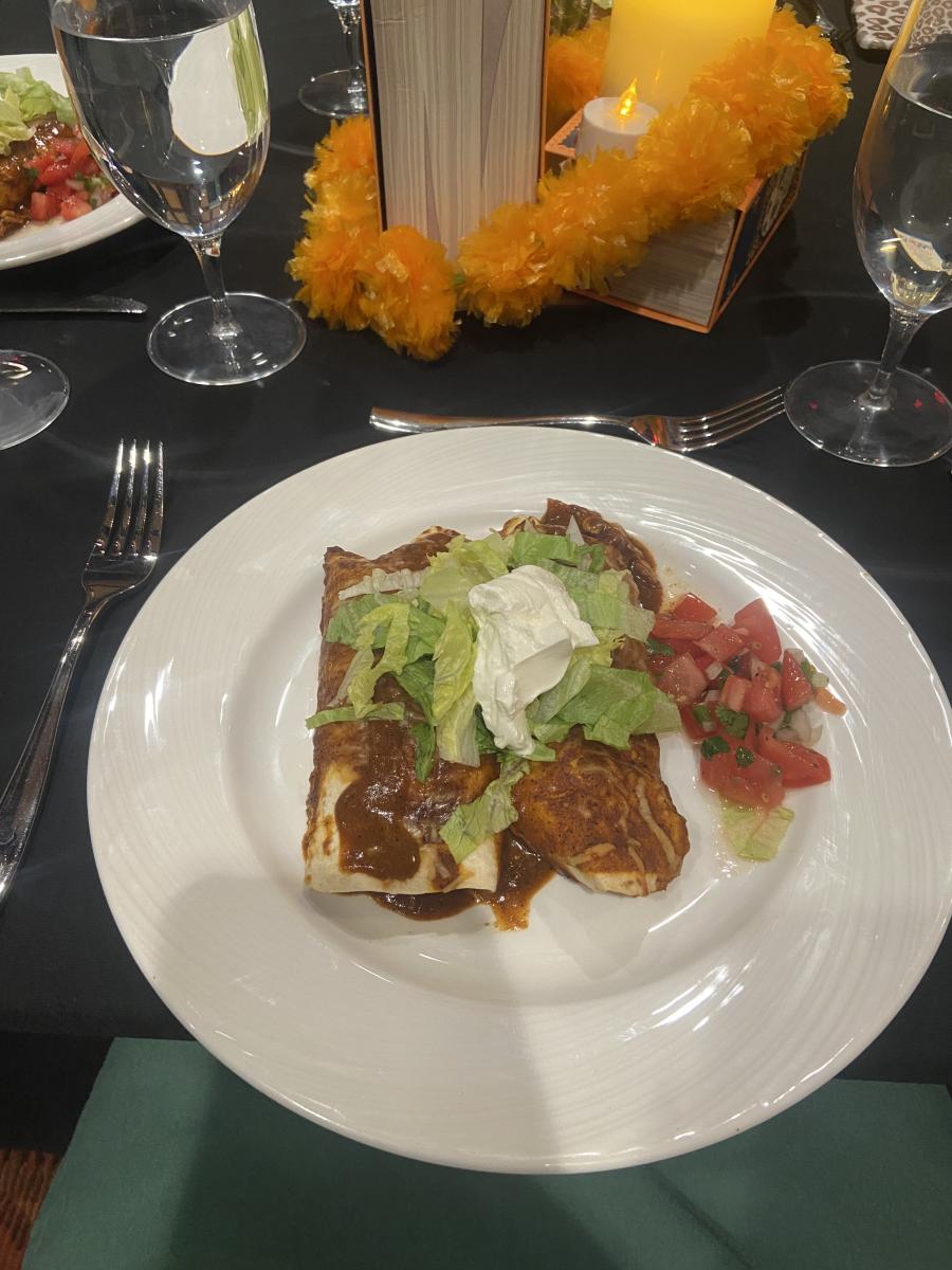 Plated enchiladas at a dinner event.