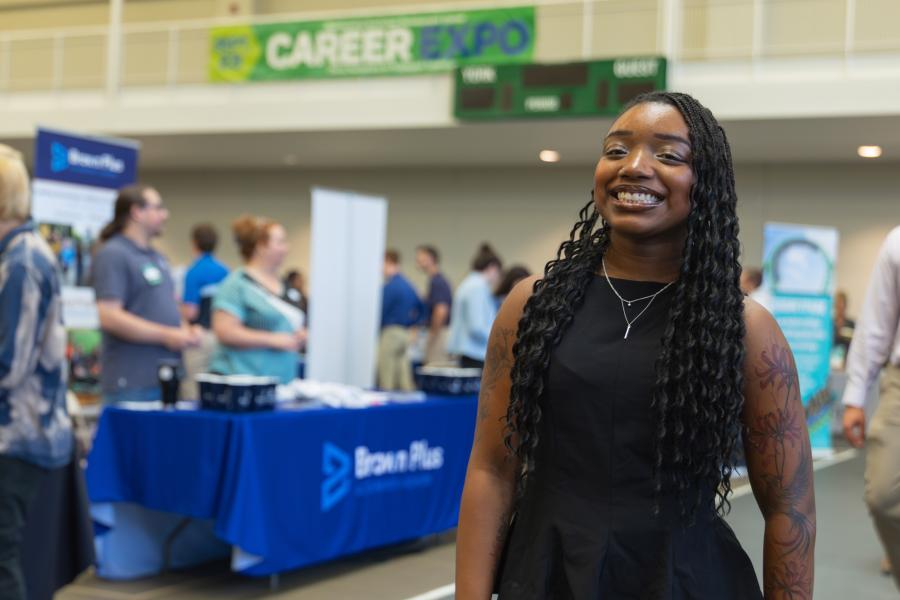 Career expo student poses for photo