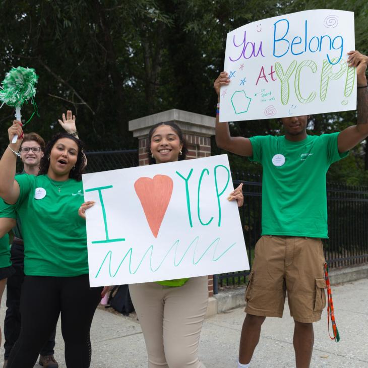 A group of students cheering during Move In Day.